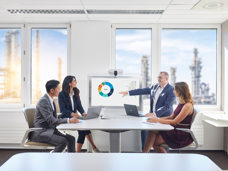 People at a desk looking at DIBA