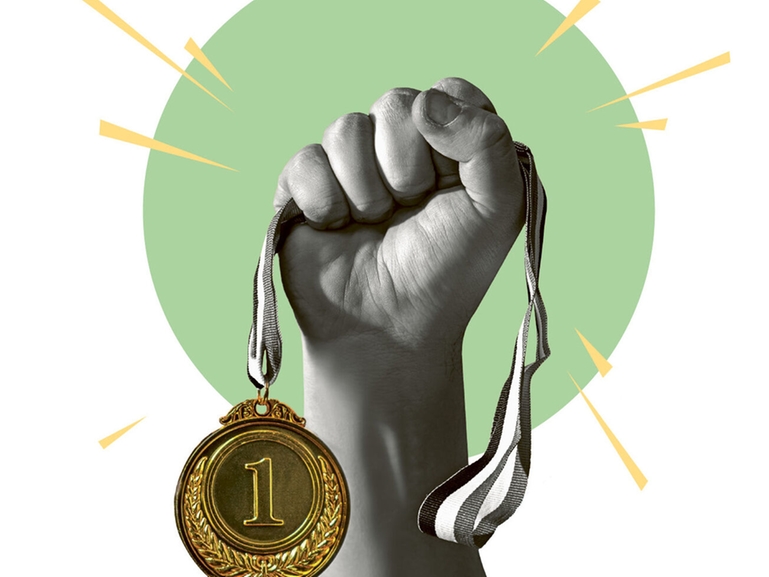 Gold medal in a hand