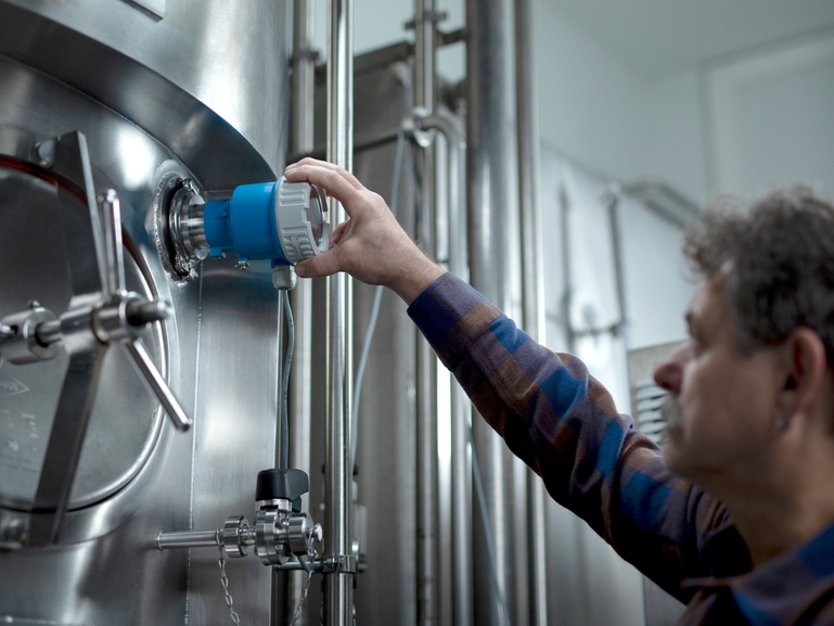 Brew master installing new fermentation monitor QWX43