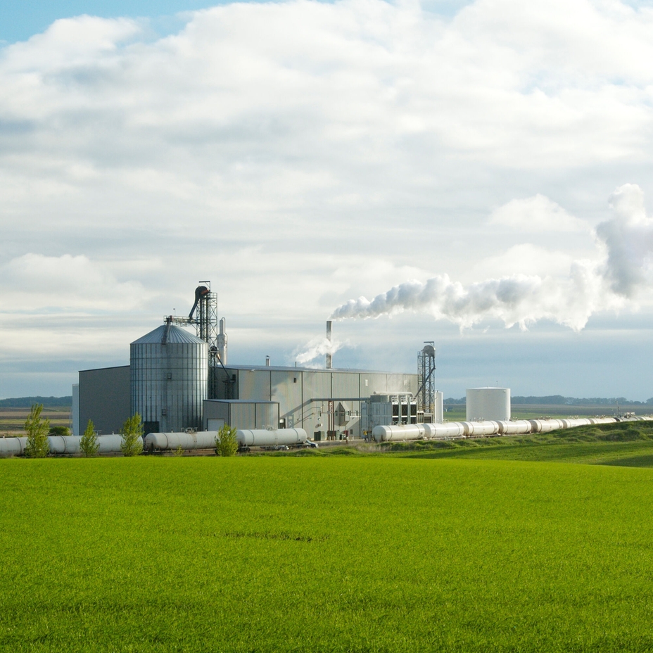 Industrial biodiesel production plant with processing units and storage silos