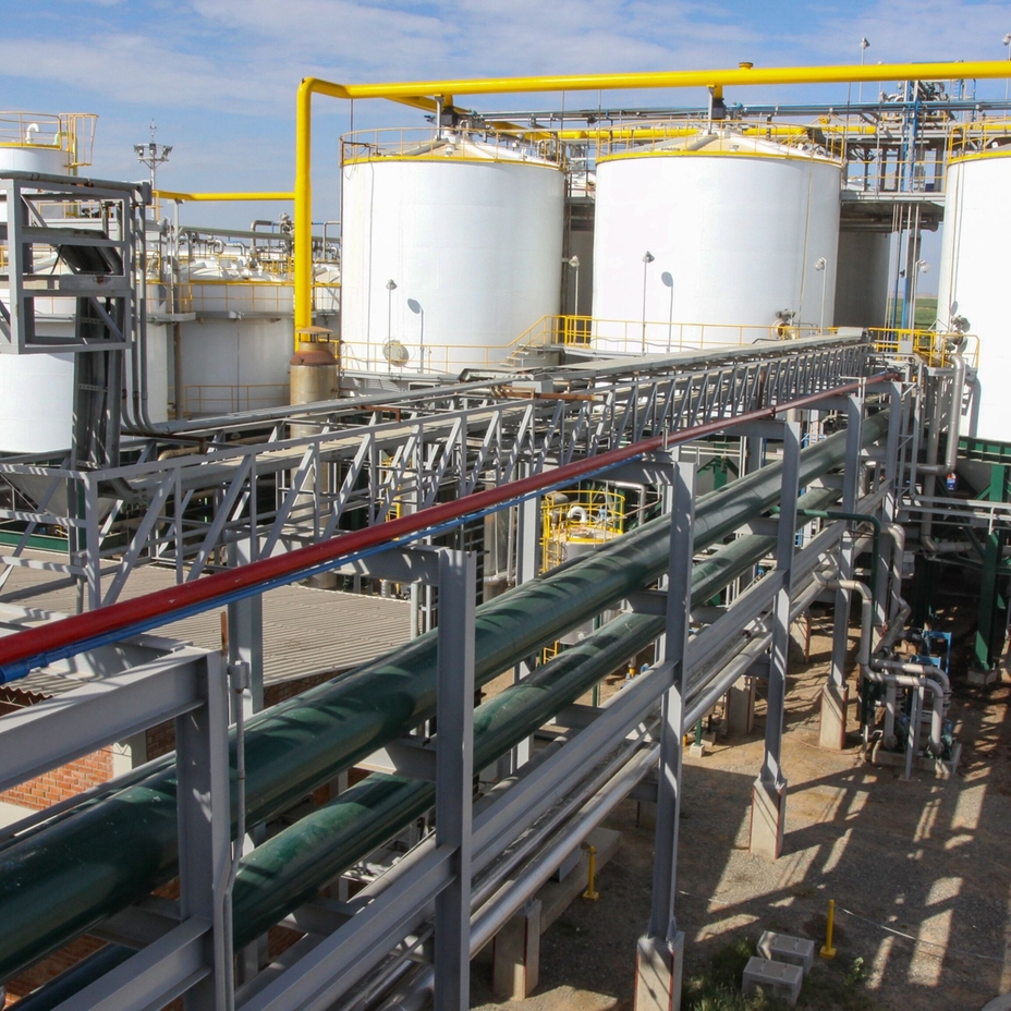 Biodiesel production plant with storage tanks and processing pipelines