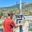 Employee at a fish farm checks data on the Liquiline transmitter