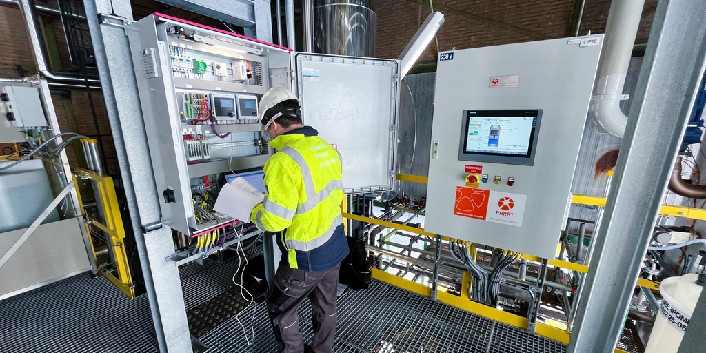 Service engineer in e-boiler room