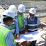 Employees of Comin Khmere Co., Ltd working at a waste water plant in Cambodia