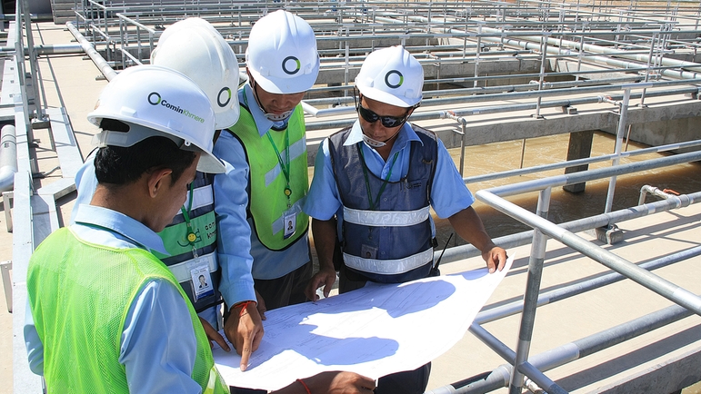 Employees of Comin Khmere Co., Ltd working at a waste water plant in Cambodia