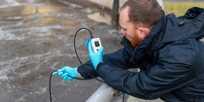 Service engineer doing oxygen measurements in an aeration basin with the Liquiline Mobile CML18